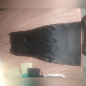 Sliky tight crossed back spaghetti strapped little black dress. Size petite